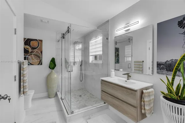 a view of a house with a yard patio and fire pit