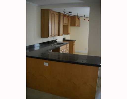 3 Royal Palm Way Boca Raton, FL 33432 - Photo 7 of 14 a bathroom with a granite countertop sink and a mirror