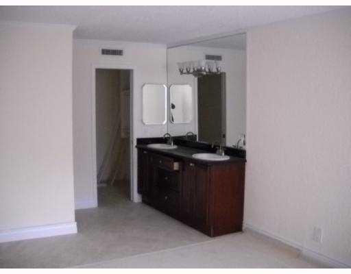 3 Royal Palm Way Boca Raton, FL 33432 - Photo 10 of 14 a room with cabinets and window