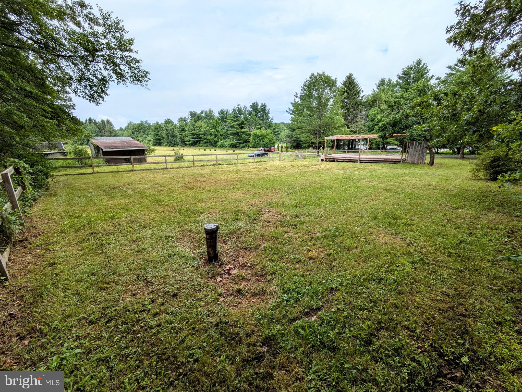 223 Brink Road Saylorsburg, PA 18353 - Photo 8 of 19 a view of a lake with a yard and trees