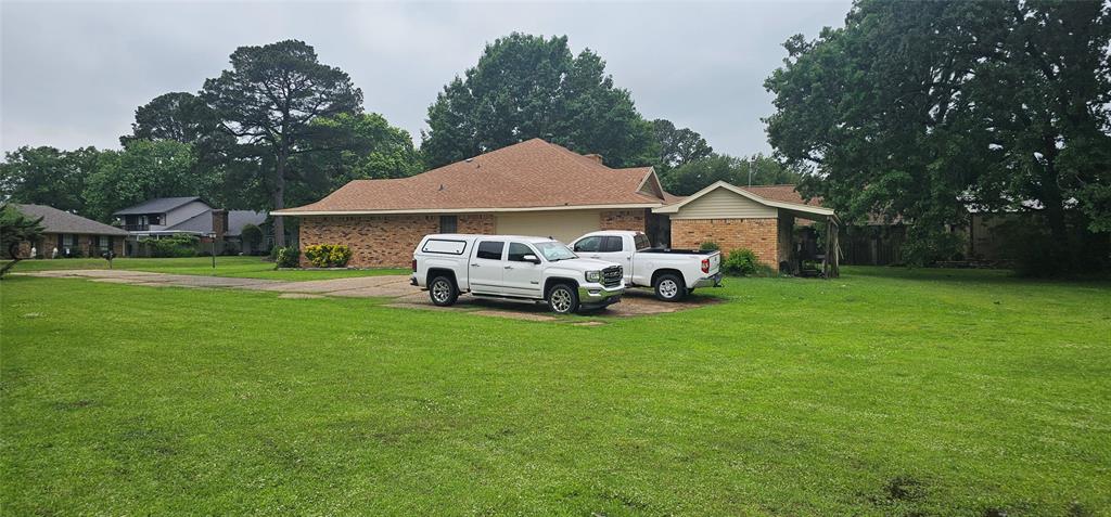 2 Woodfern Lane Haughton, LA 71037 - Photo 33 of 33 a front view of a house with garden