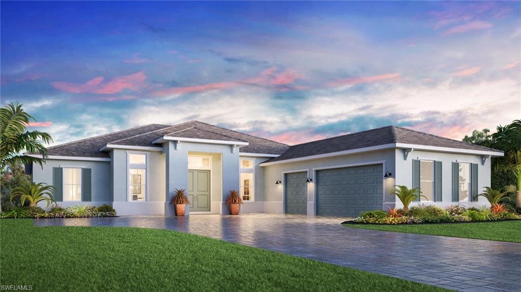 8558 Oceana Way Naples, FL 34114 - Photo 21 of 25 a front view of a house with a garden and yard