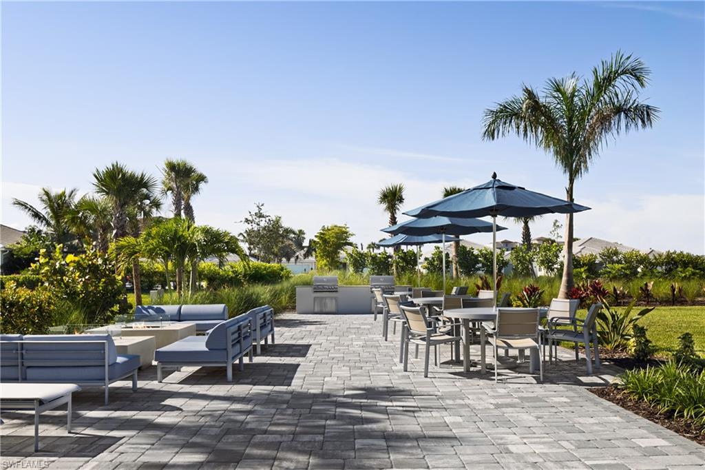 8558 Oceana Way Naples, FL 34114 - Photo 19 of 25 an outdoor space with seating