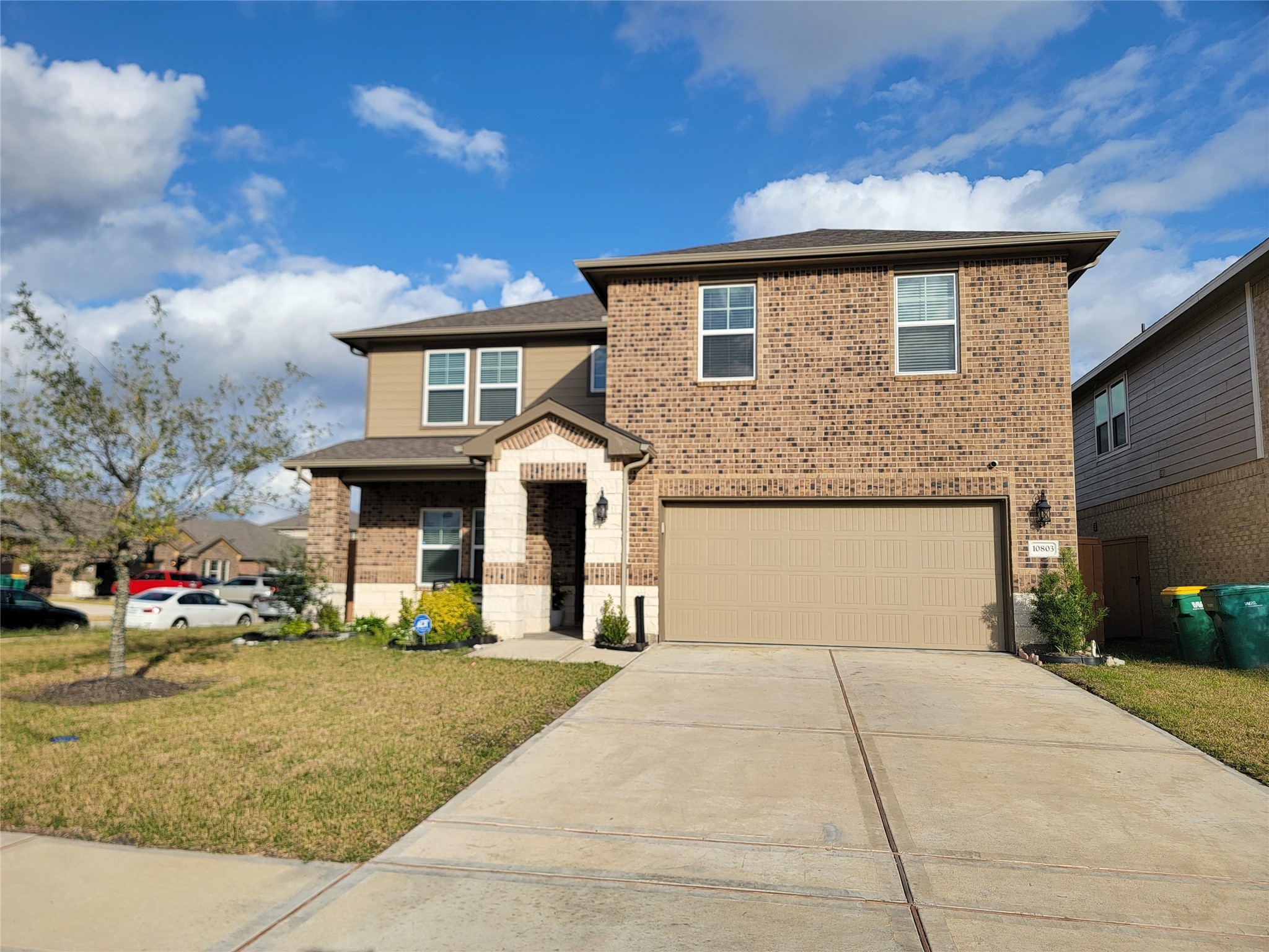 10803 Sugar Pne Lane Rosharon, TX 77583 - Photo 1 of 18 a front view of a house with a garden