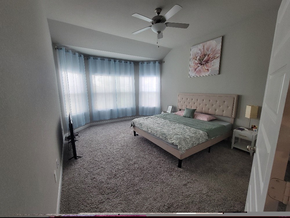 10803 Sugar Pne Lane Rosharon, TX 77583 - Photo 11 of 18 a bedroom with a bed and window