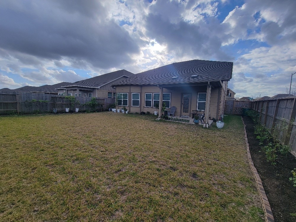 10803 Sugar Pne Lane Rosharon, TX 77583 - Photo 17 of 18 a view of a house with a yard