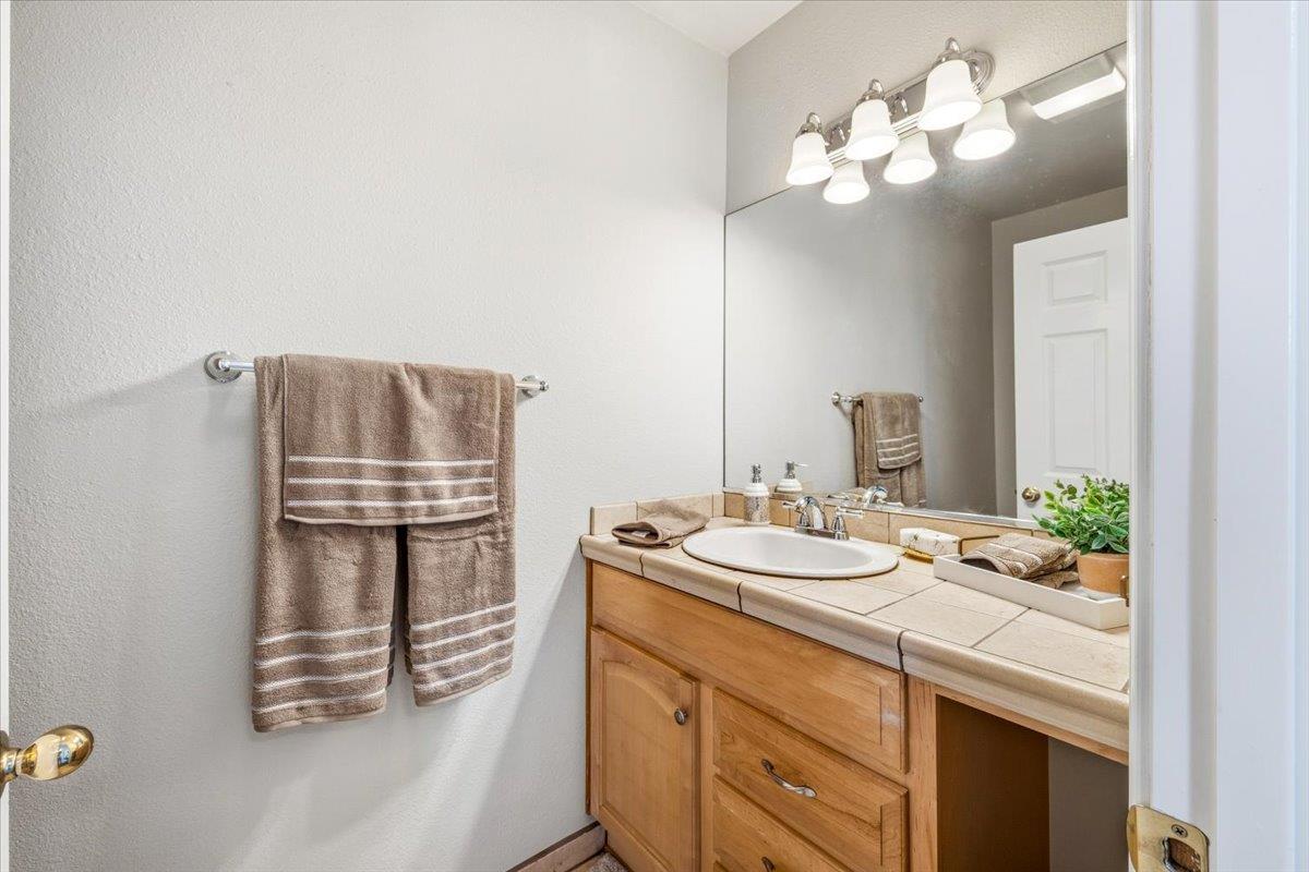 232 Upper Slate Creek Road Grass Valley, CA 95945 - Photo 16 of 48 a bathroom with a sink and a mirror