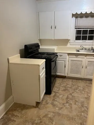 a view of a kitchen with a sink