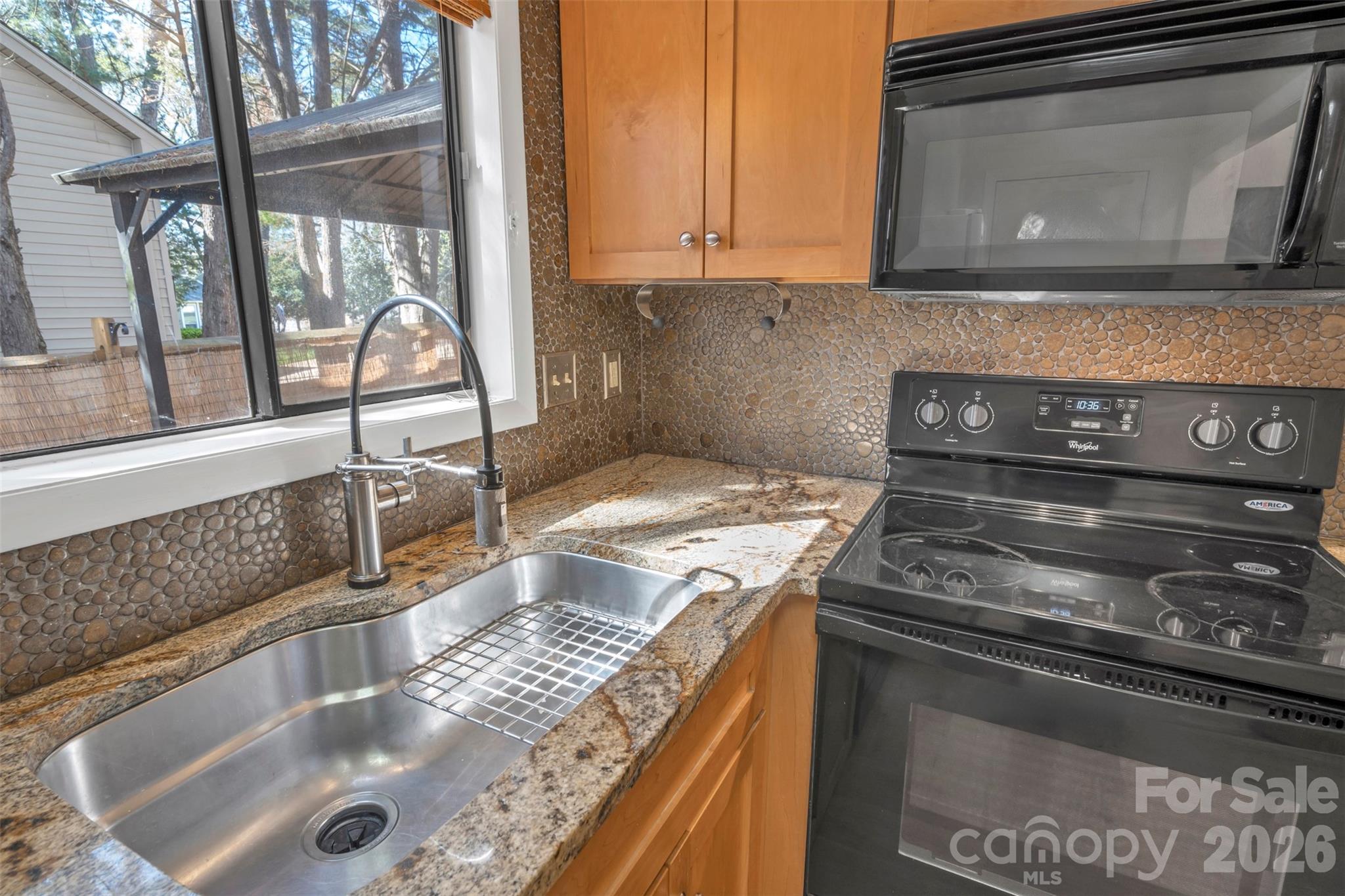 1121 Mai Kai Way Fort Mill, SC 29708 - Photo 12 of 35 a kitchen with a stove and a sink