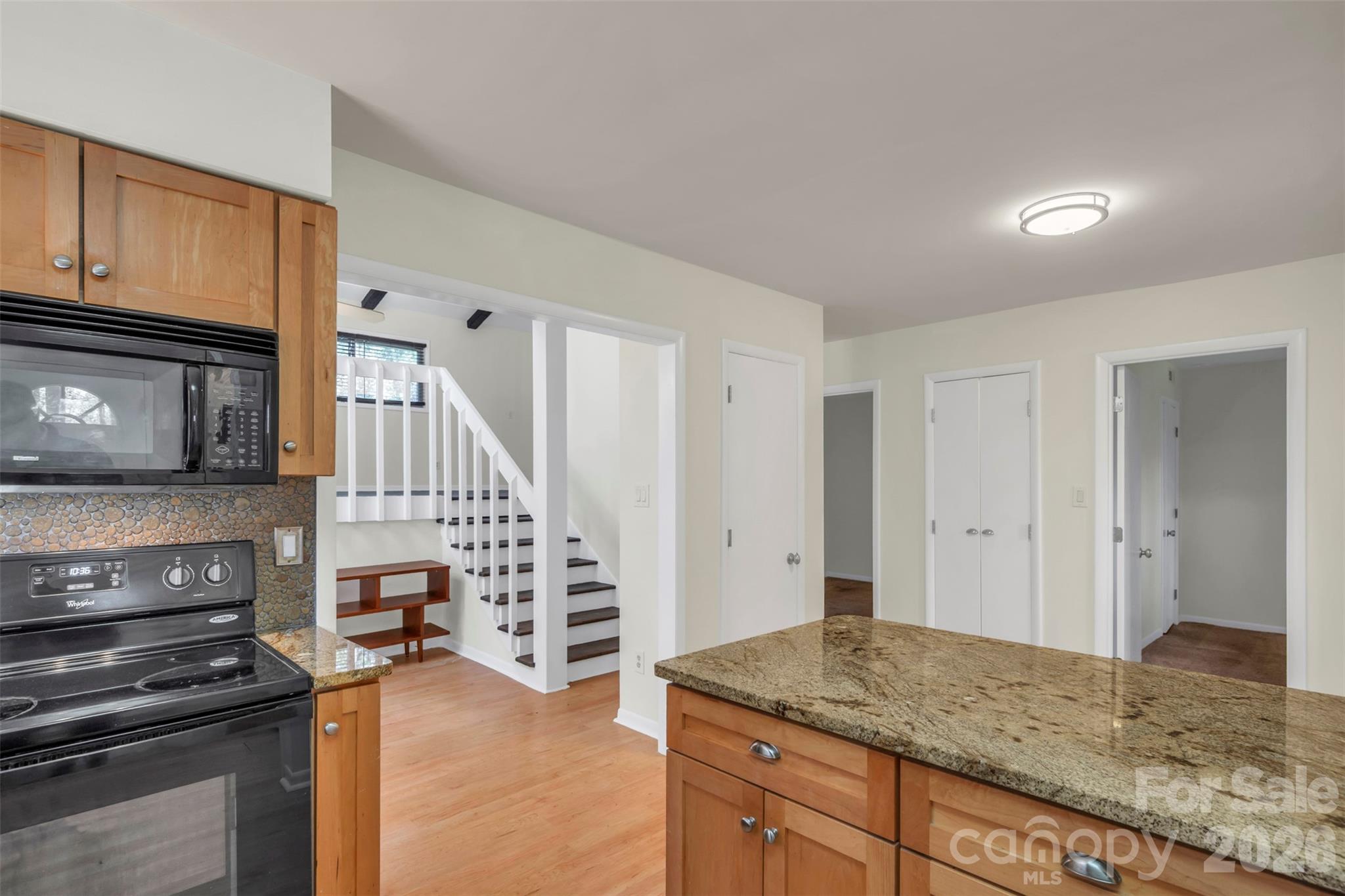 1121 Mai Kai Way Fort Mill, SC 29708 - Photo 13 of 35 a kitchen with granite countertop a stove and cabinets