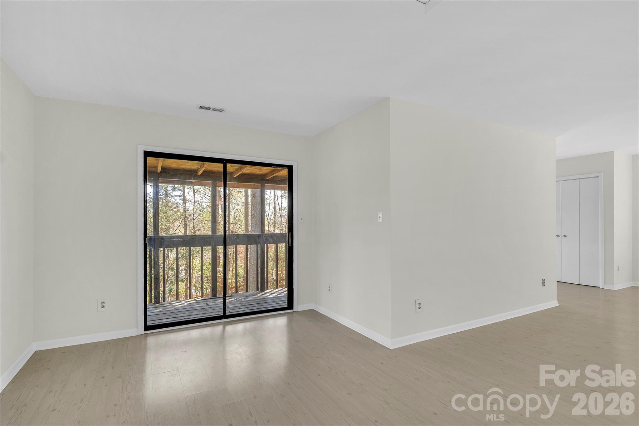 1121 Mai Kai Way Fort Mill, SC 29708 - Photo 23 of 35 an empty room with wooden floor and windows