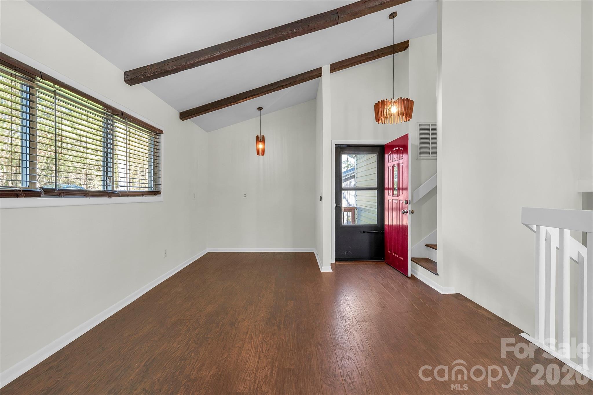 1121 Mai Kai Way Fort Mill, SC 29708 - Photo 4 of 35 an empty room with wooden floor and windows