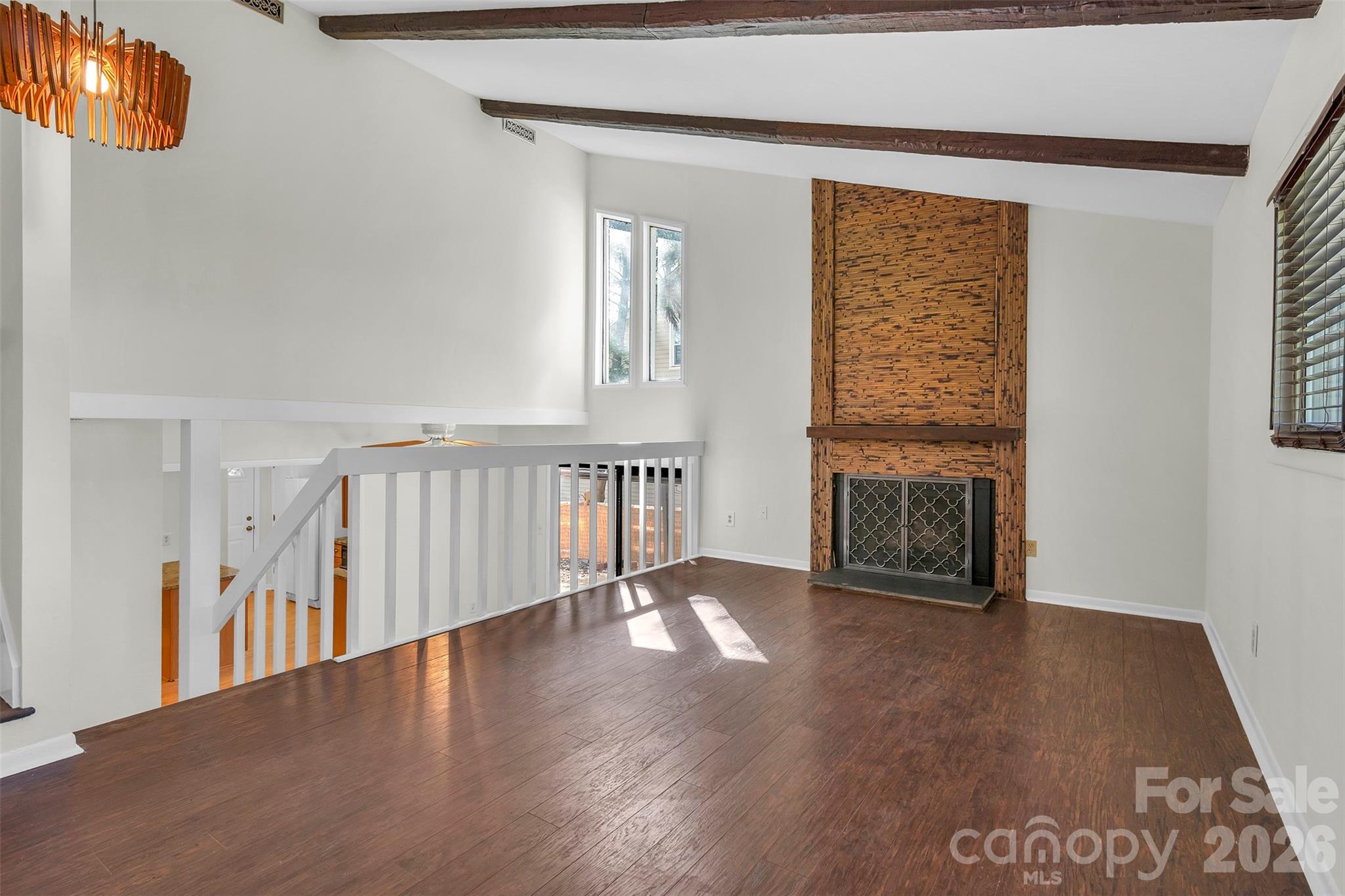 1121 Mai Kai Way Fort Mill, SC 29708 - Photo 6 of 35 a view of an empty room with wooden floor and a window