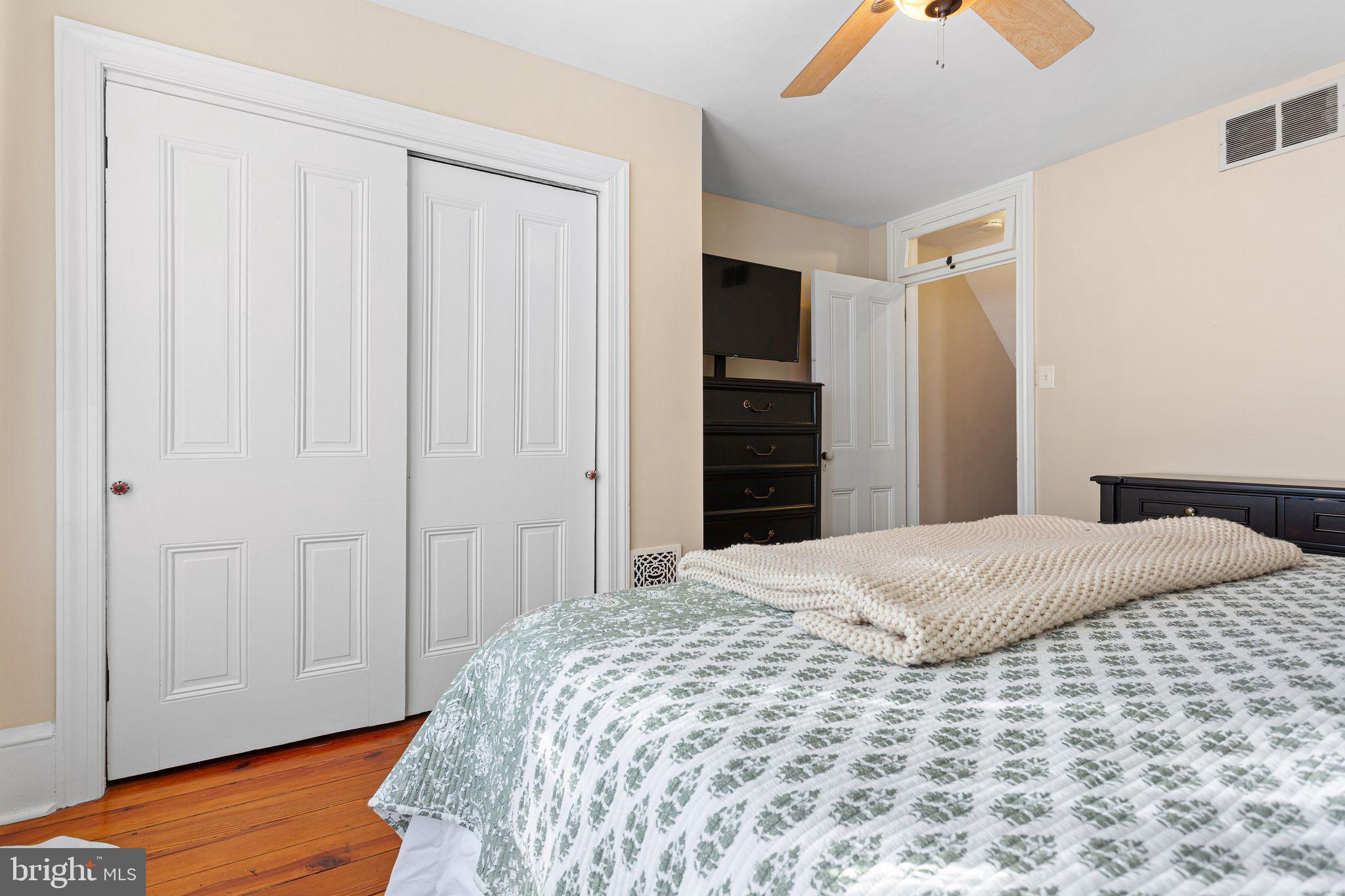 109 West Euclid Avenue Haddonfield, NJ 08033 - Photo 17 of 32 a bedroom with a bed and wooden floor