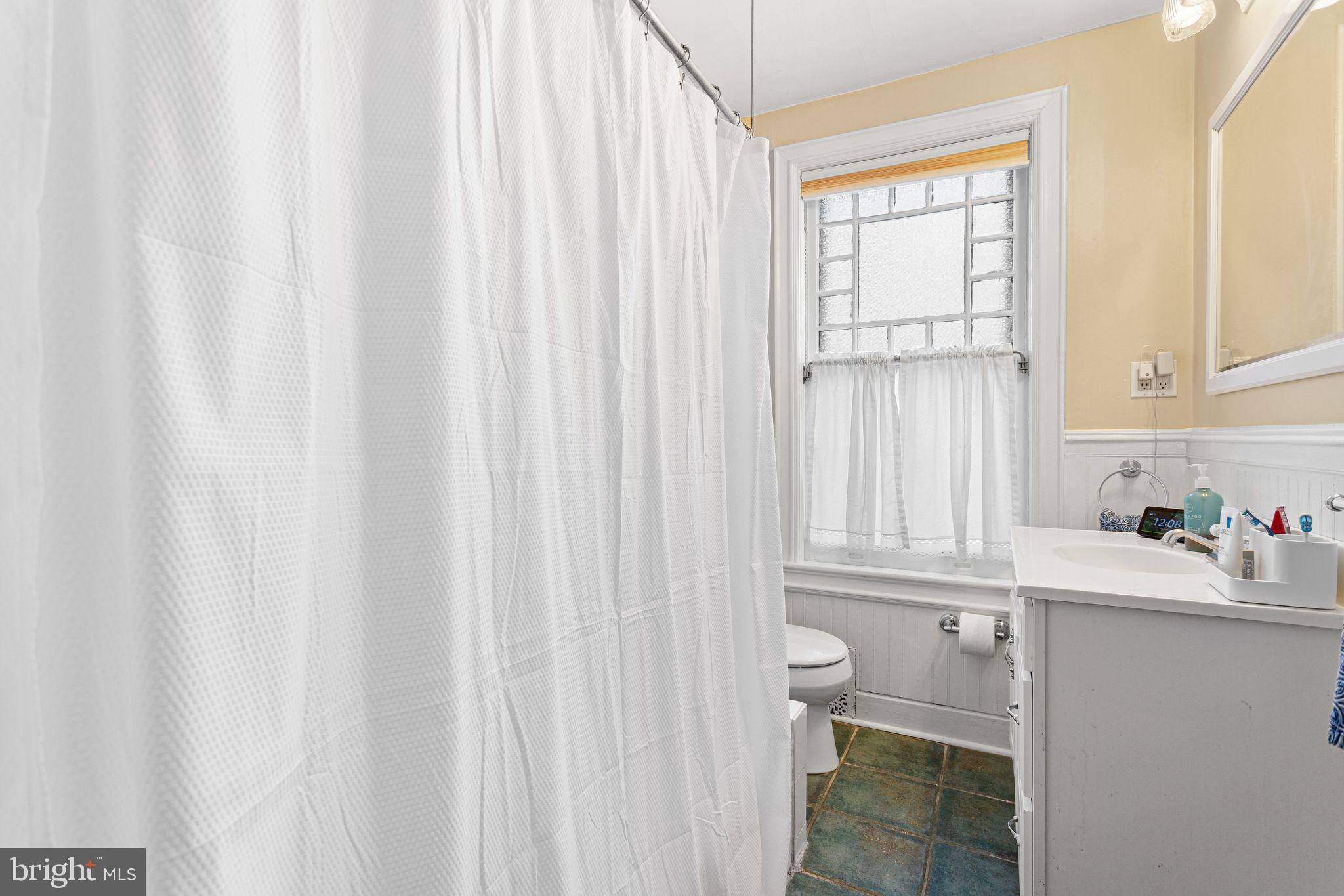 109 West Euclid Avenue Haddonfield, NJ 08033 - Photo 22 of 32 a bathroom with a sink toilet and window