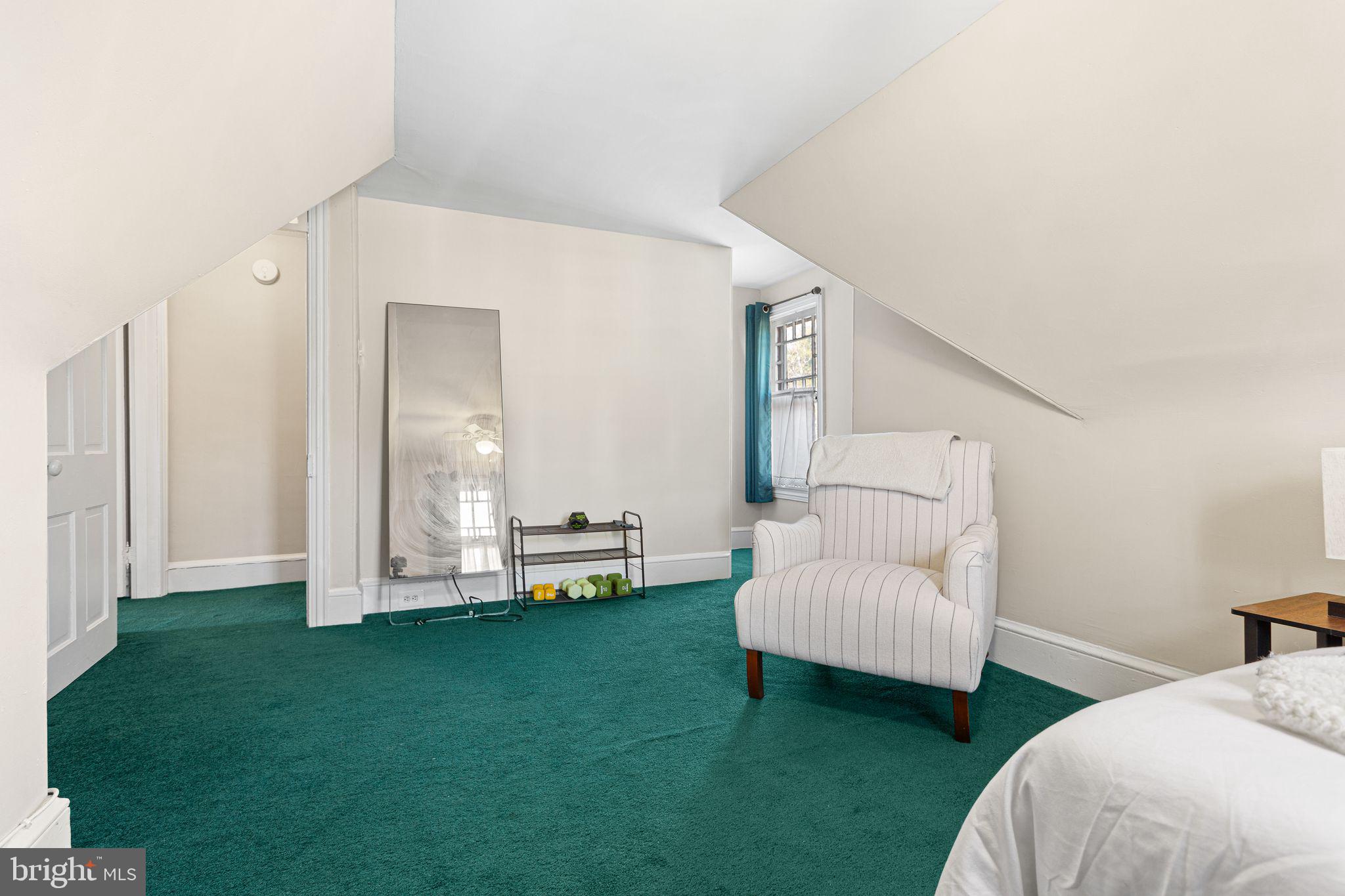 109 West Euclid Avenue Haddonfield, NJ 08033 - Photo 27 of 32 a spacious bedroom with a bed and a couch
