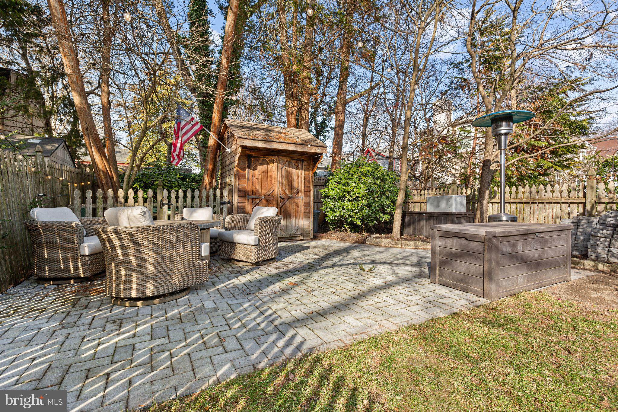 109 West Euclid Avenue Haddonfield, NJ 08033 - Photo 29 of 32 a view of a patio with table and chairs and potted plants