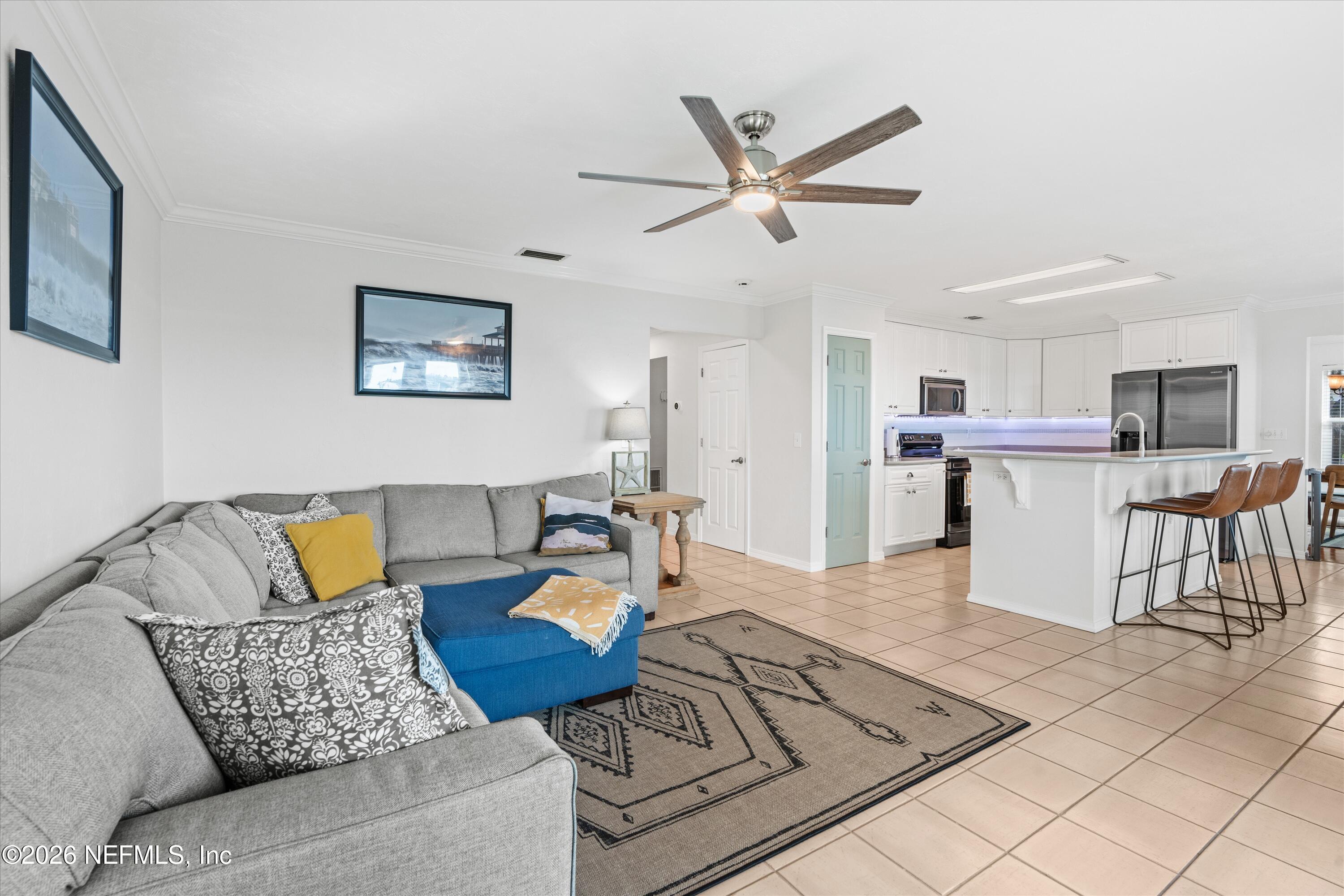 5532 Sunset Landing Circle St. Augustine, FL 32080 - Photo 16 of 43 a living room with furniture and kitchen view