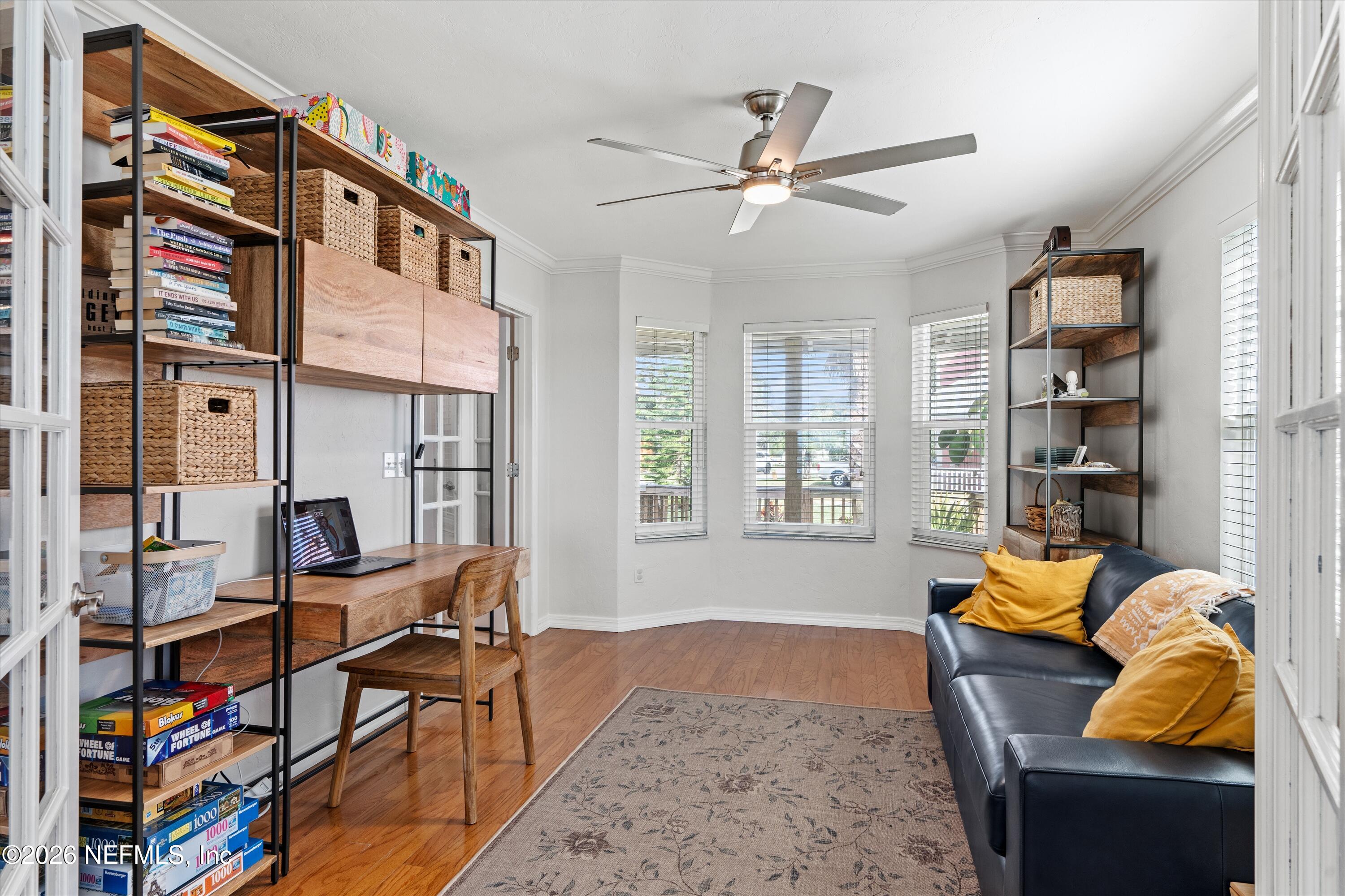 5532 Sunset Landing Circle St. Augustine, FL 32080 - Photo 22 of 43 a living room with furniture cabinets and window
