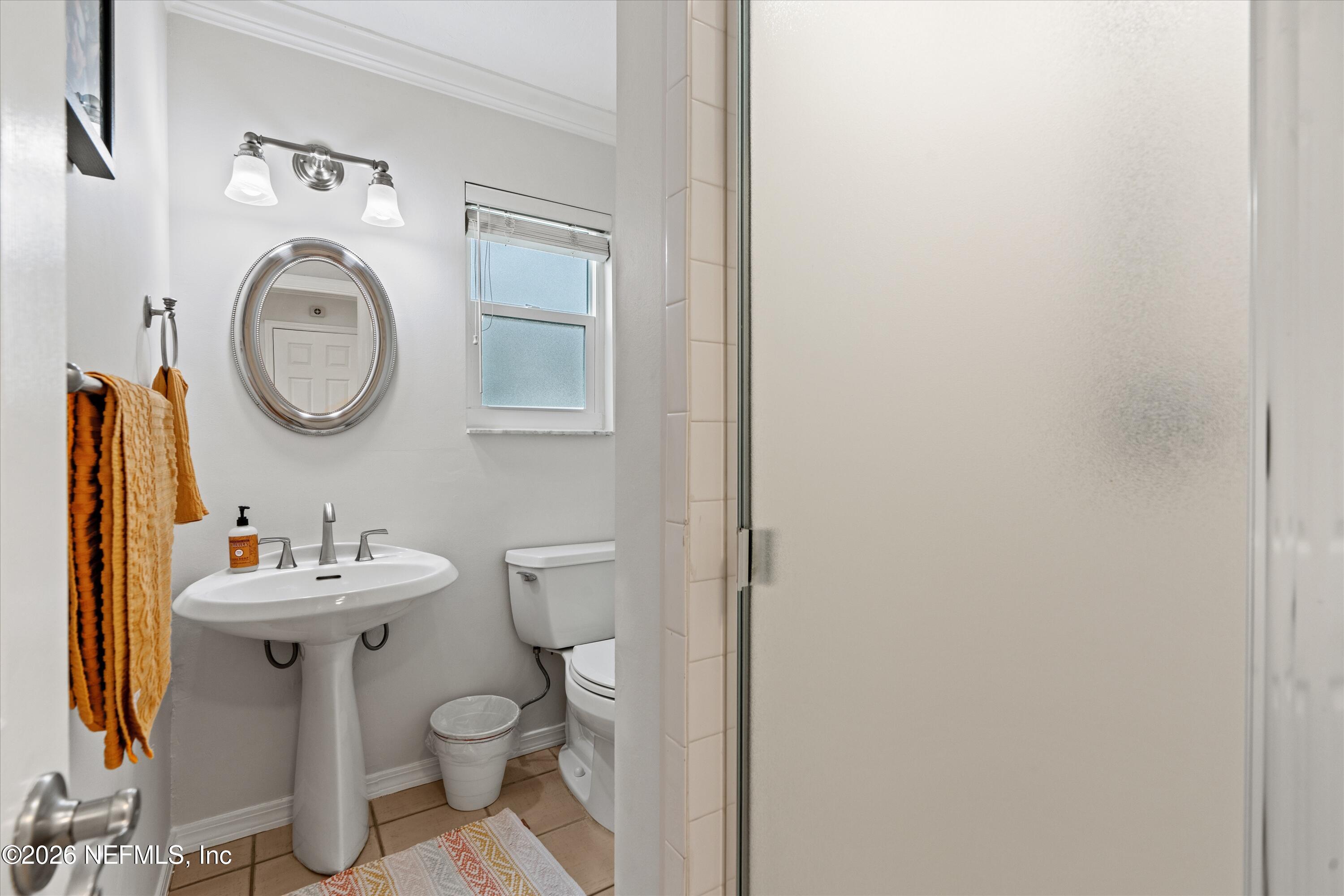 5532 Sunset Landing Circle St. Augustine, FL 32080 - Photo 23 of 43 a bathroom with a toilet a sink and a mirror