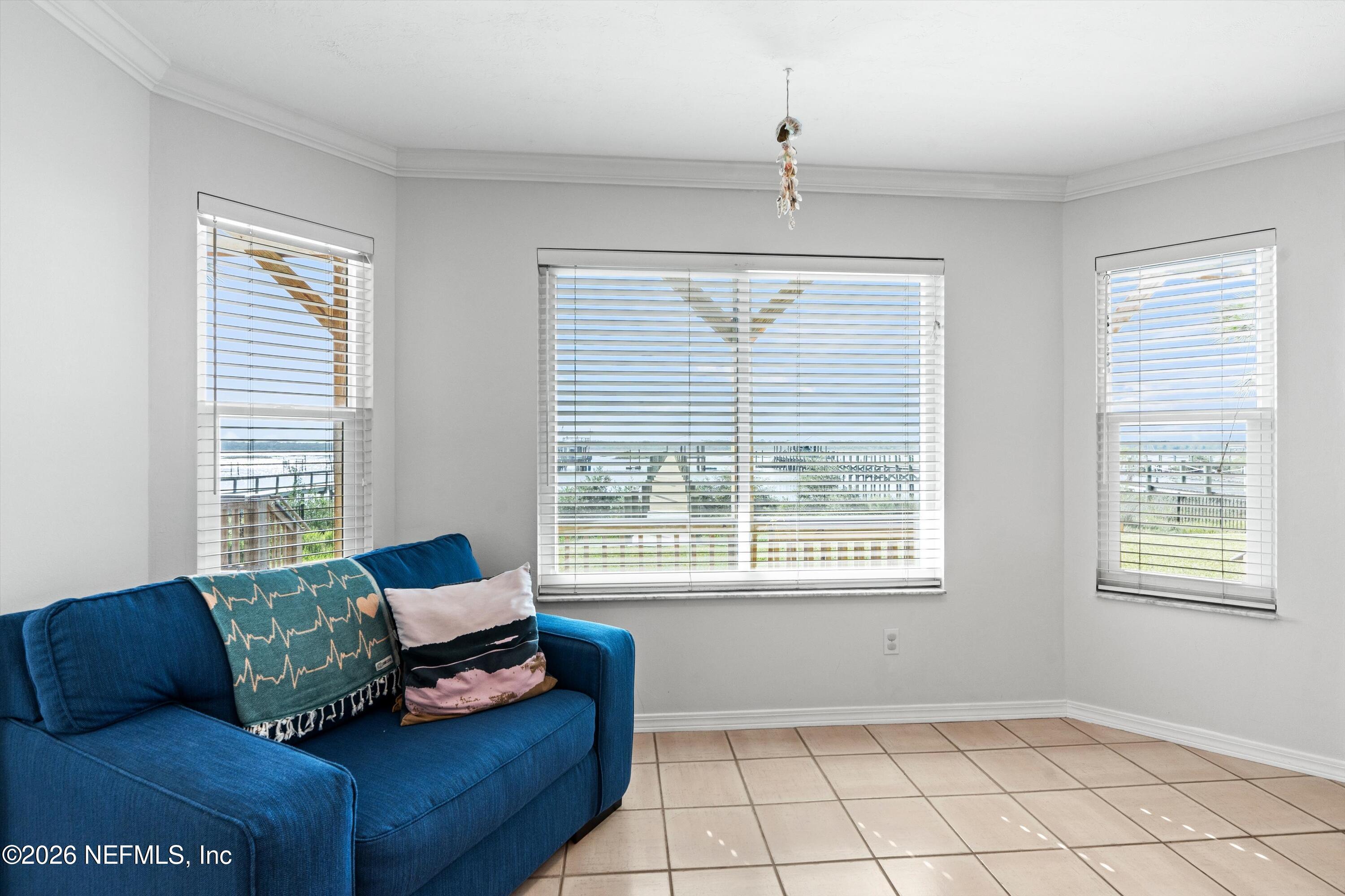5532 Sunset Landing Circle St. Augustine, FL 32080 - Photo 30 of 43 a living room with furniture and a window