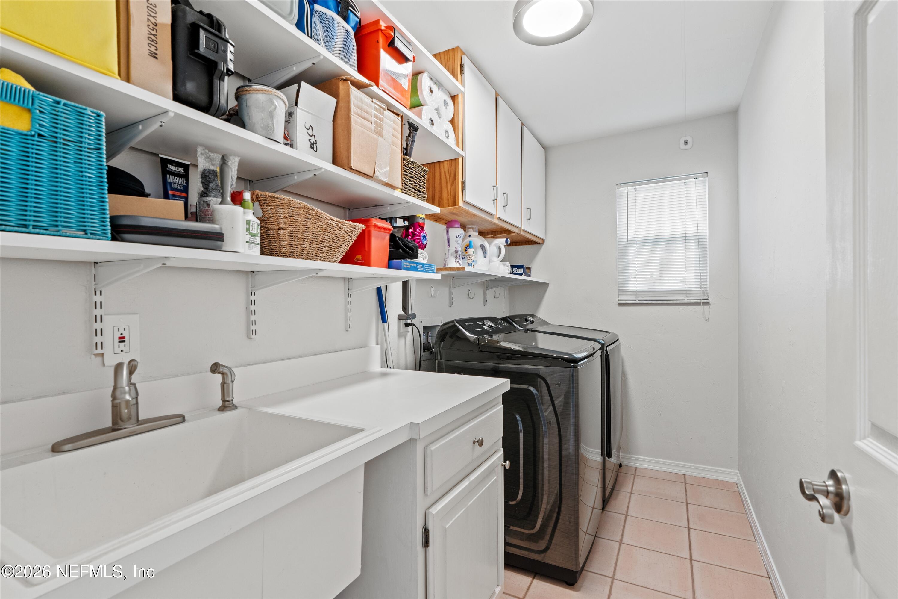 5532 Sunset Landing Circle St. Augustine, FL 32080 - Photo 32 of 43 a utility room with dryer and washer