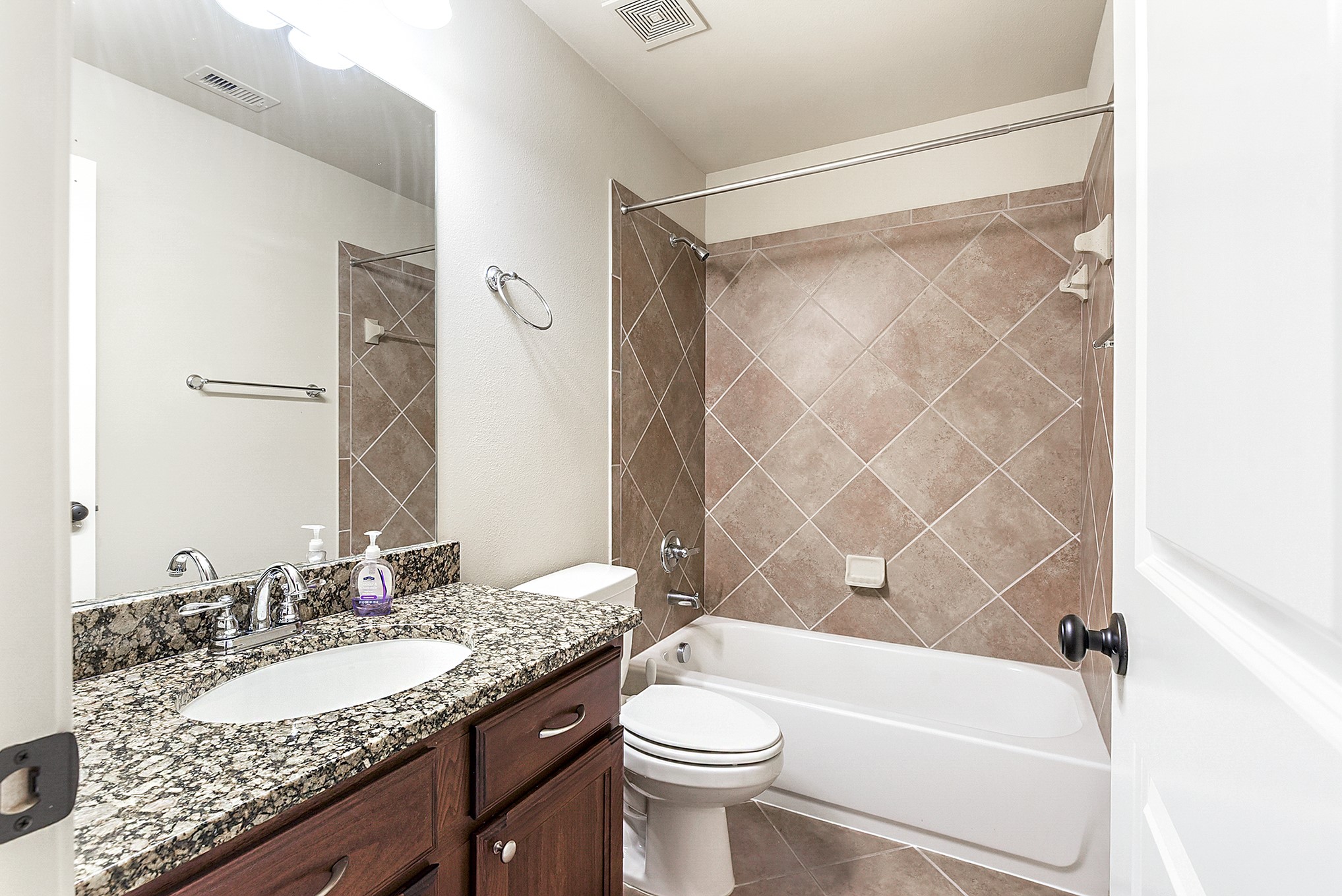 29023 Powder Ridge Drive Katy, TX 77494 - Photo 30 of 50 Upstairs offers two full bathrooms. This bathroom is conveniently located closest to one of the upstairs bedrooms and features a large vanity with ample counter space and a tub/shower combination.