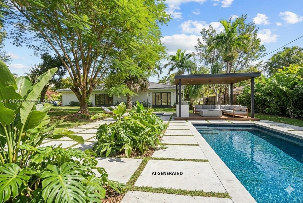 12820 Southwest 83rd Court Pinecrest, FL 33156 - Photo 12 of 38 a view of a backyard with sitting area