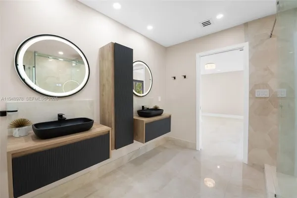 a bathroom with a toilet a sink and a mirror