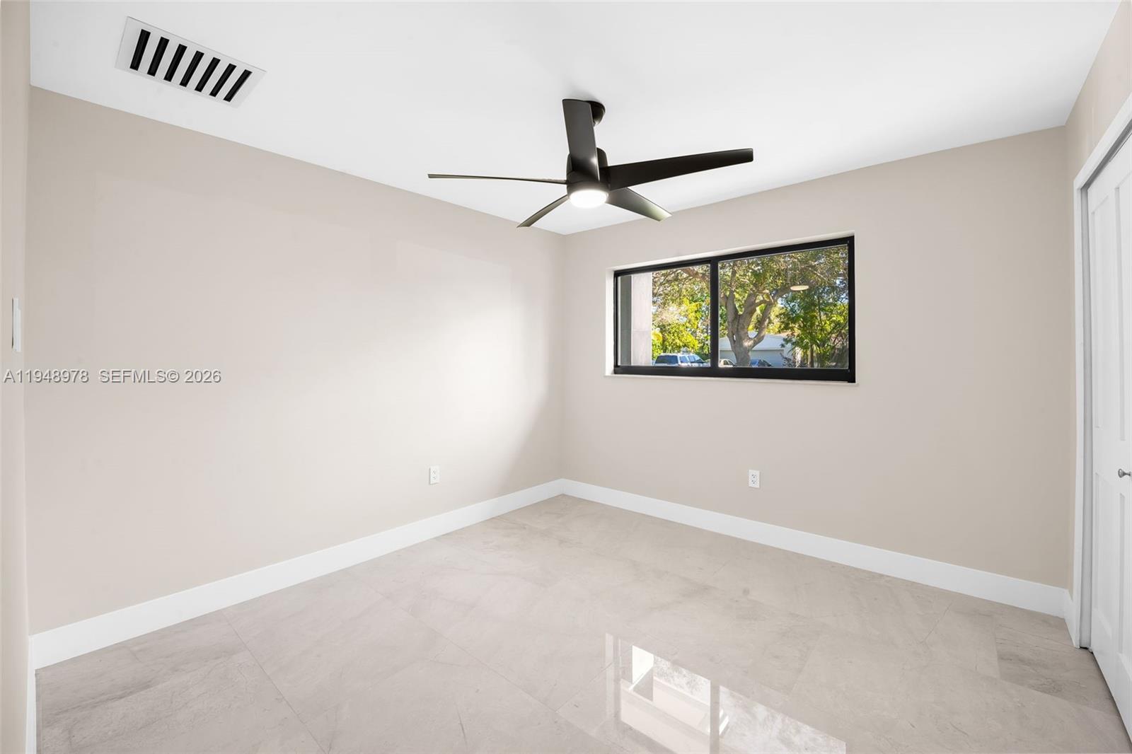 12820 Southwest 83rd Court Pinecrest, FL 33156 - Photo 18 of 38 an empty room with windows