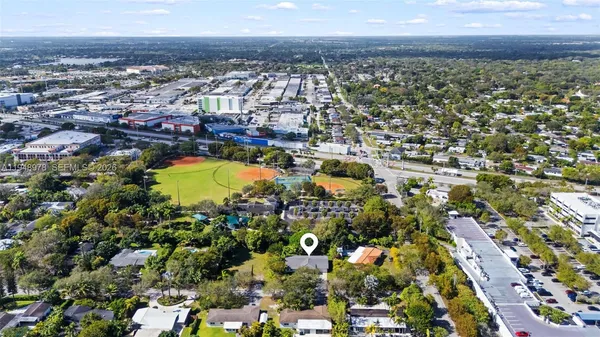 an aerial view of residential houses with outdoor space