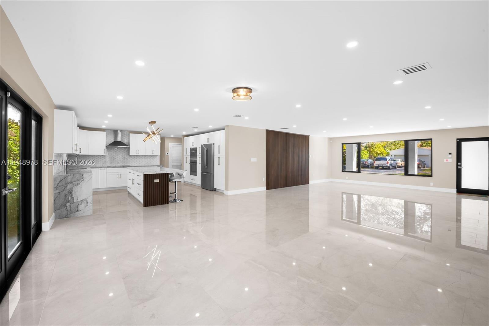 12820 Southwest 83rd Court Pinecrest, FL 33156 - Photo 6 of 38 a view of kitchen with stainless steel appliances a refrigerator and a stove top oven