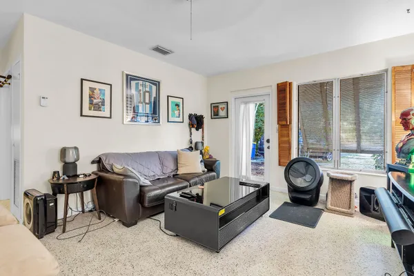 a bedroom with a bed and a table