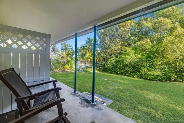 a view of a room with porch and a backyard