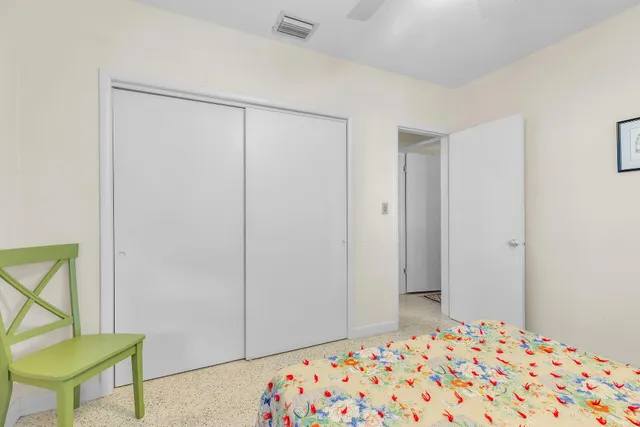 a bedroom with a bed and a table