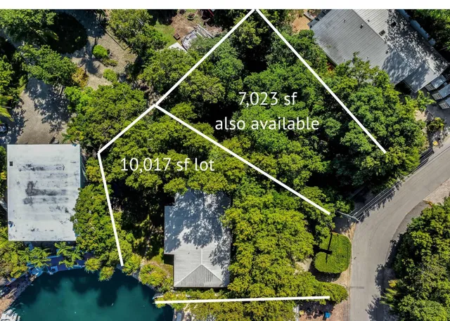 an aerial view of water swimming pool and outdoor seating