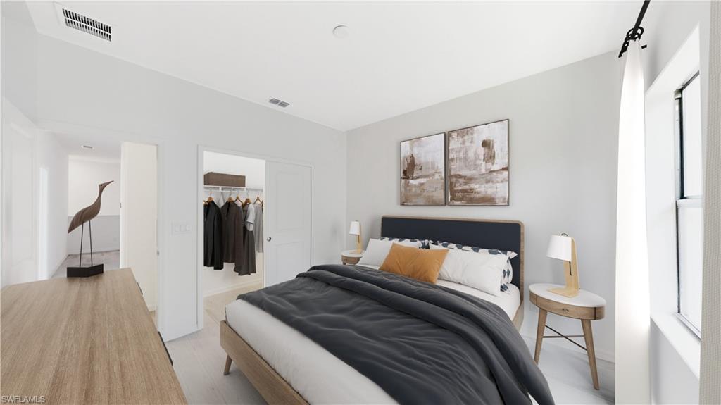 3134 Juniper Way Naples, FL 34112 - Photo 22 of 28 Bedroom featuring light wood finished floors