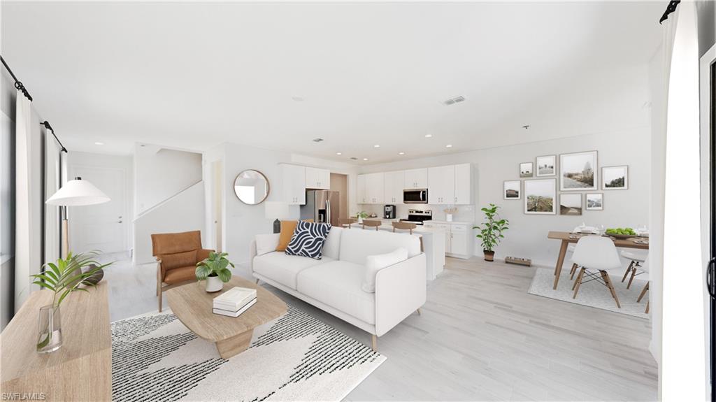 3134 Juniper Way Naples, FL 34112 - Photo 5 of 28 Living room featuring light wood-style floors, recessed lighting, and a barn door