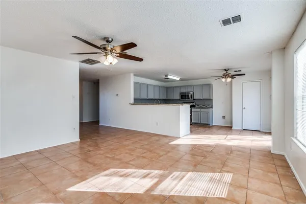 a view of a kitchen with a sink and a kitchen view
