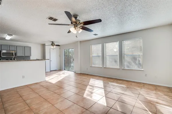 a view of a kitchen with a sink and a window
