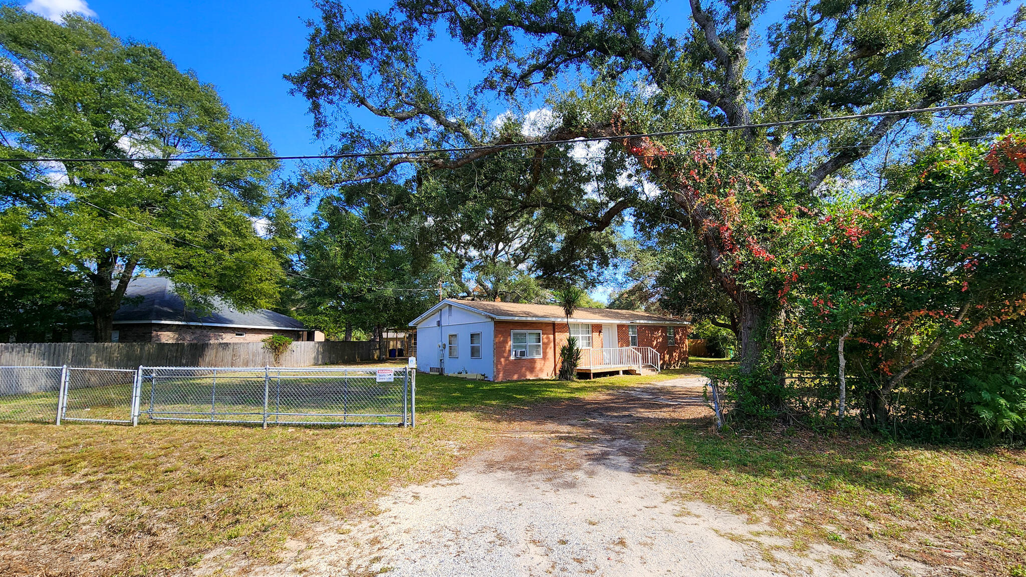 a view of house with a big yard