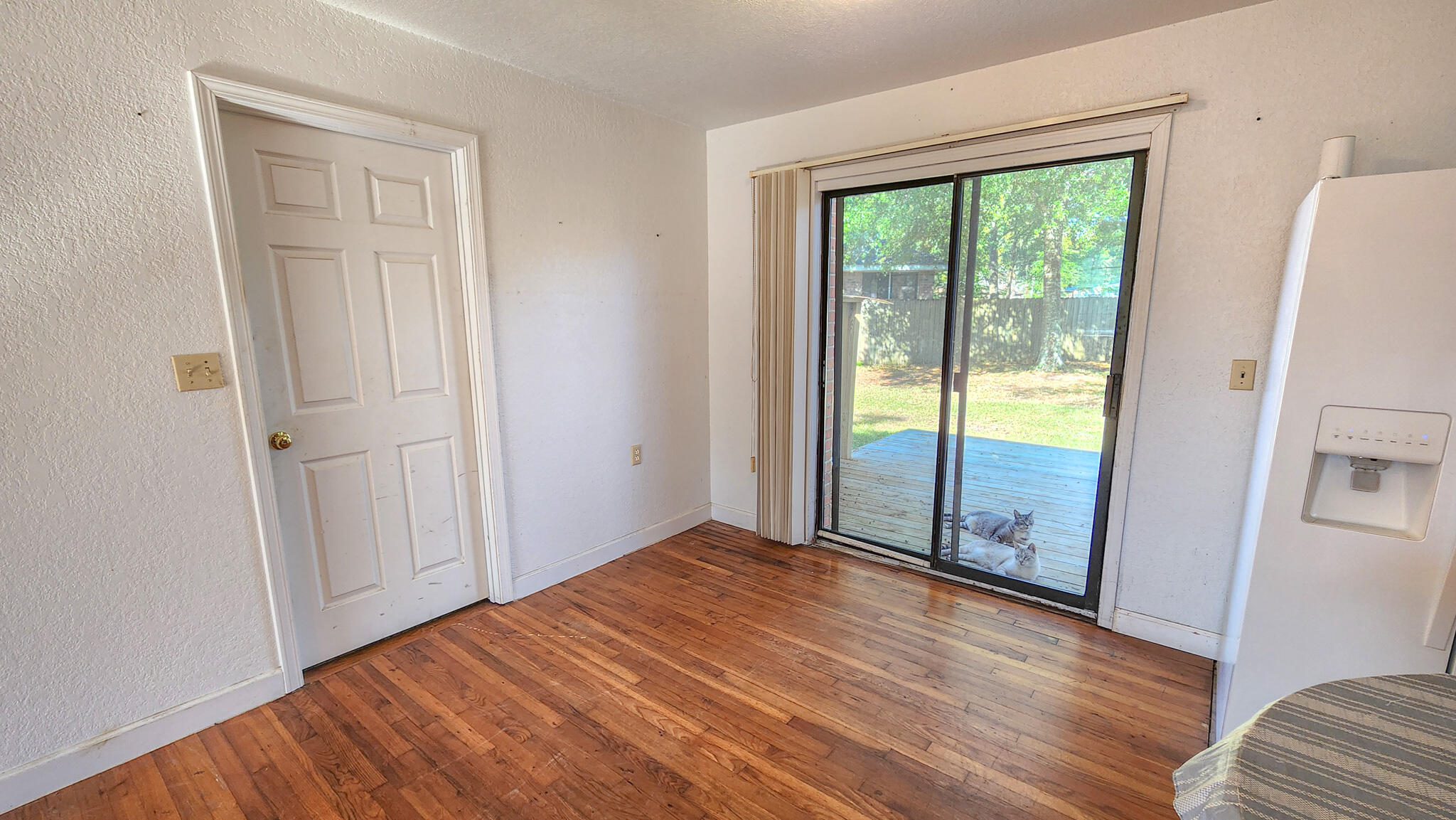 1200 Forest Heights Road Fort Walton Beach, FL 32547 - Photo 14 of 24 an empty room with wooden floor and windows