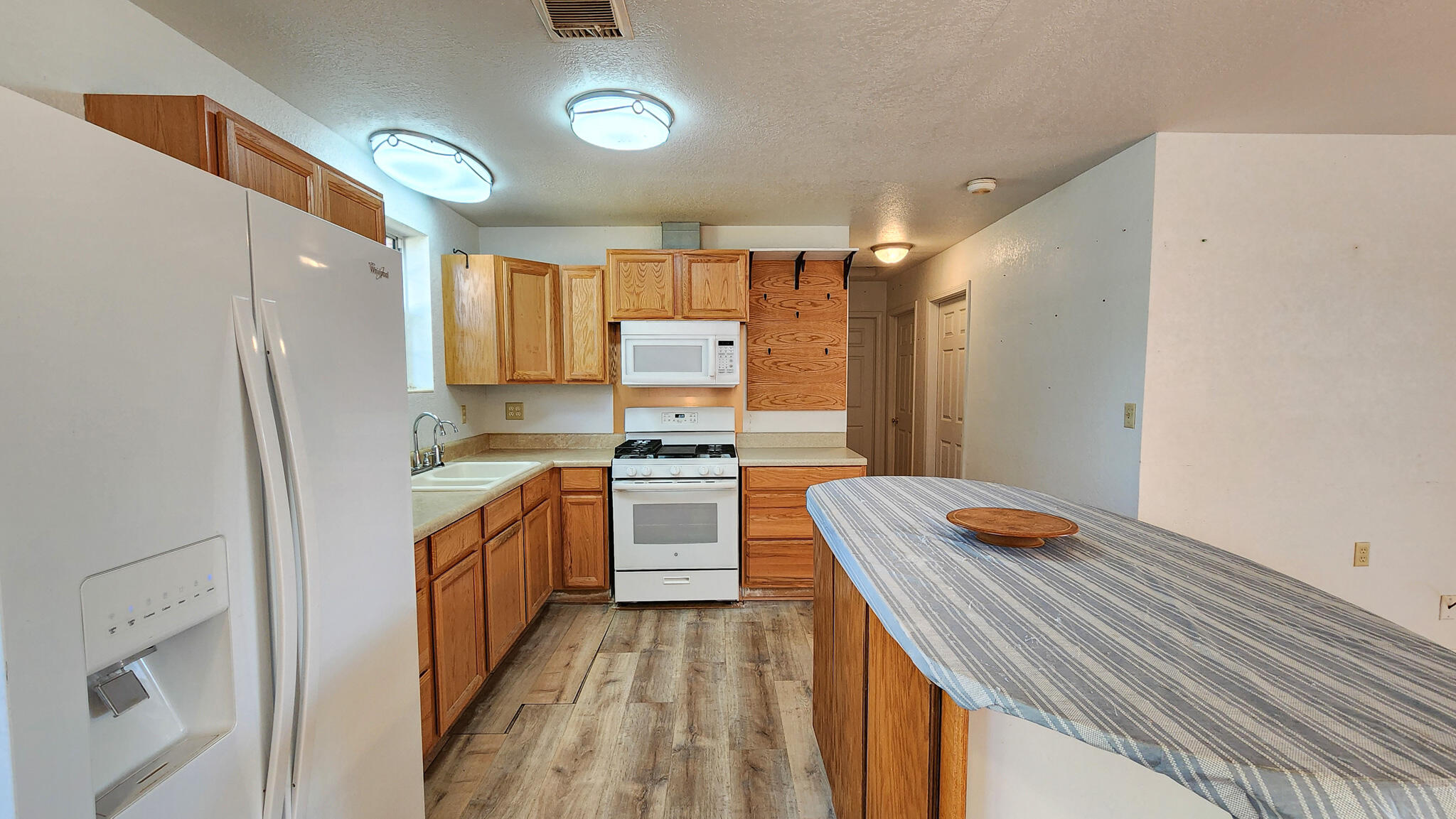 1200 Forest Heights Road Fort Walton Beach, FL 32547 - Photo 15 of 24 a kitchen with a sink stove and refrigerator