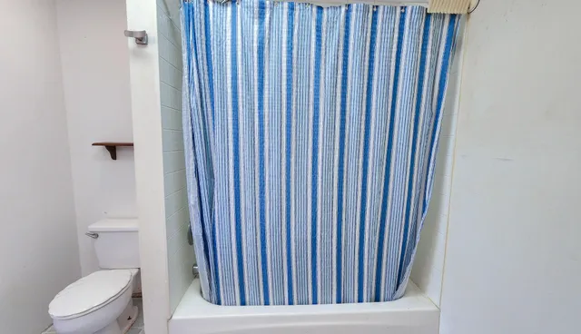 a view of a bathroom with a toilet