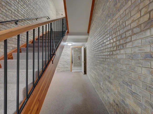 a view of hallway with wooden floor