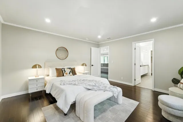 a bedroom with a bed and a couch