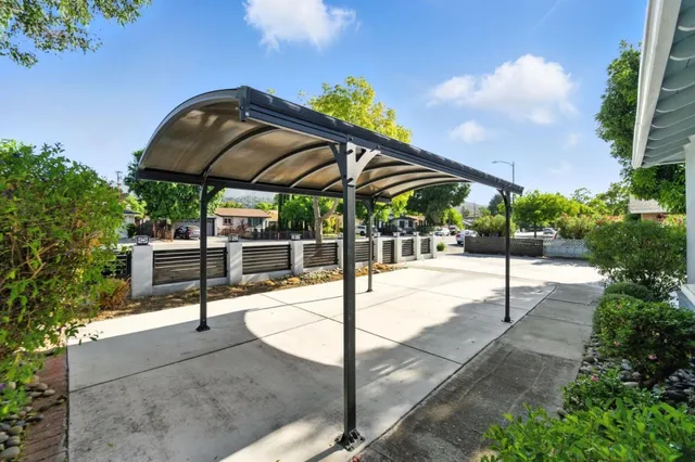 a view of a backyard with sitting area