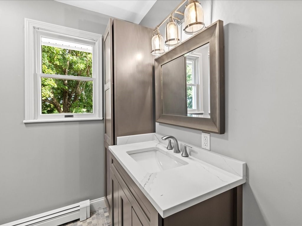37 Summer Street Dighton, MA 02764 - Photo 14 of 34 a bathroom with a sink a vanity and a mirror
