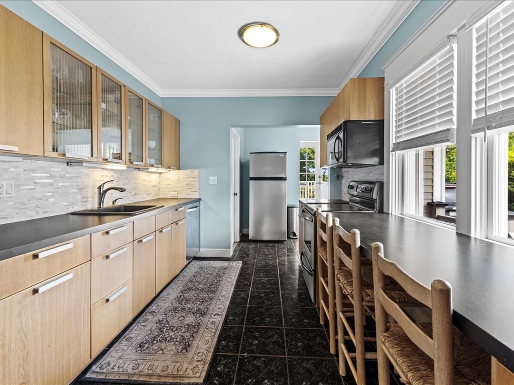 37 Summer Street Dighton, MA 02764 - Photo 22 of 34 a kitchen with stainless steel appliances granite countertop a sink and wooden cabinets