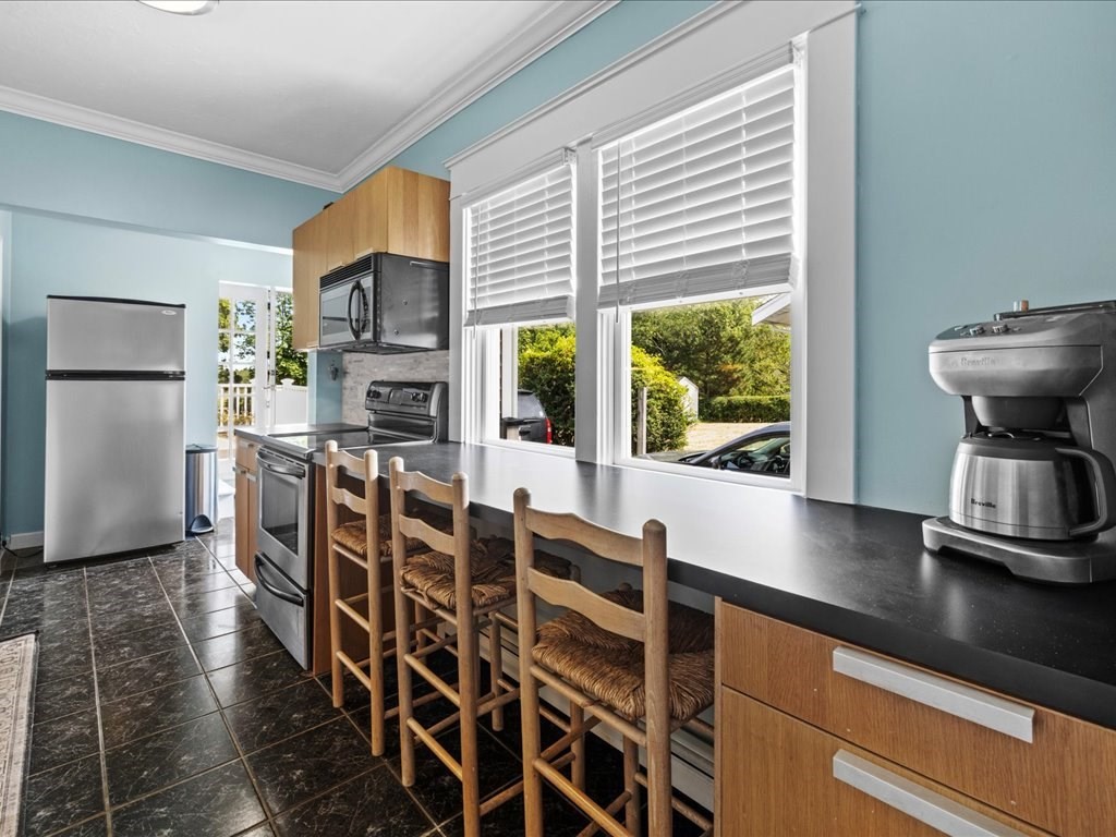 37 Summer Street Dighton, MA 02764 - Photo 23 of 34 a open kitchen with stainless steel appliances granite countertop a stove a refrigerator a oven with white cabinets and wooden floor